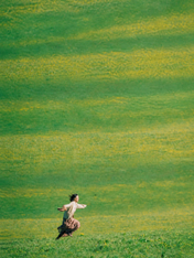 Woman Running in Green Field Wall Art Print - unframed